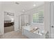 Bright and airy main bathroom with separate shower and tub at 1011 Wadsworth Ln, Indian Trail, NC 28079
