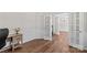 Office space with hardwood floors, wainscoting, and glass-paneled door at 1011 Wadsworth Ln, Indian Trail, NC 28079