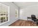 Office featuring hardwood floors, wainscoting, and natural light from the windows at 1011 Wadsworth Ln, Indian Trail, NC 28079