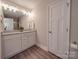 This bathroom features a double sink vanity with nice cabinets and flooring at 1016 Forest Dr, Marshville, NC 28103