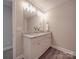 This bathroom features a double sink vanity and stylish lighting at 1016 Forest Dr, Marshville, NC 28103