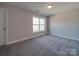 A bright bedroom with a view to the yard is ready for your personal touch at 1016 Forest Dr, Marshville, NC 28103