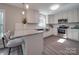 Modern kitchen featuring white cabinets, stainless steel appliances, and a granite countertop at 1016 Forest Dr, Marshville, NC 28103