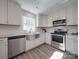 Updated kitchen with stainless steel appliances, white cabinets, and a subway tile backsplash at 1016 Forest Dr, Marshville, NC 28103