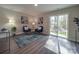 Comfortable living area with sliding doors and a tranquil view of the trees at 1016 Forest Dr, Marshville, NC 28103