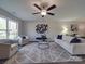 Cozy living room with a ceiling fan, stylish furniture, and natural light at 1016 Forest Dr, Marshville, NC 28103