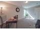 Bright office space with warm lighting, a view to the yard, and gray accents at 1016 Forest Dr, Marshville, NC 28103