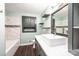 Updated bathroom featuring a modern sink, dark gray vanity, decorative shelving and tiled shower at 1036 11Th Street Circle Nw Dr, Hickory, NC 28601