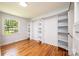 Bedroom with closet system and wood floor at 1036 11Th Street Circle Nw Dr, Hickory, NC 28601