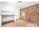 Large laundry room with exposed brick and lots of storage at 1036 11Th Street Circle Nw Dr, Hickory, NC 28601