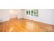 Living room featuring a bay window that lets in natural light and beautiful hardwood flooring at 1036 11Th Street Circle Nw Dr, Hickory, NC 28601