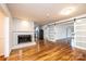 Bright living room features a fireplace, hardwood flooring, and sliding barn doors at 1036 11Th Street Circle Nw Dr, Hickory, NC 28601