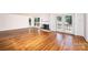 Bright living room boasts hardwood floors, a fireplace, and access to the outdoors through French doors at 1036 11Th Street Circle Nw Dr, Hickory, NC 28601