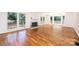 Bright living room boasts hardwood floors, a fireplace, and access to the outdoors through French doors at 1036 11Th Street Circle Nw Dr, Hickory, NC 28601
