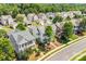 An aerial view displays neighborhood homes with manicured lawns and mature trees at 10509 Serape Rd, Charlotte, NC 28277