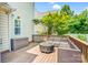 Inviting back deck features a modern seating arrangement, fire pit, and privacy storage at 10509 Serape Rd, Charlotte, NC 28277