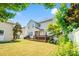 Backyard featuring lush green lawn and a wood deck, surrounded by a privacy fence at 10509 Serape Rd, Charlotte, NC 28277