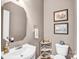 Charming powder room features traditional fixtures, a vintage-style mirror, and decorative accents at 10509 Serape Rd, Charlotte, NC 28277