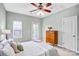 Bedroom with neutral walls, ceiling fan, a window, and a light color comforter set at 10509 Serape Rd, Charlotte, NC 28277