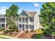 Two-story home with a welcoming front porch and classic architectural details at 10509 Serape Rd, Charlotte, NC 28277