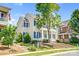 A charming two-story home with blue shutters surrounded by green landscaping at 10509 Serape Rd, Charlotte, NC 28277
