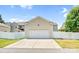 Detached two-car garage with a pristine white door and adjacent driveway, offering ample parking at 10509 Serape Rd, Charlotte, NC 28277