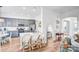 Open-concept kitchen with stainless steel appliances, breakfast bar, and adjacent living area at 10509 Serape Rd, Charlotte, NC 28277