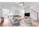 Spacious living room with hardwood floors, a neutral color palette, and a staircase at 10509 Serape Rd, Charlotte, NC 28277