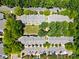 Aerial view of community with well-maintained lawns, tree-lined streets, and ample parking at 11021 Dundarrach Ln # 40, Charlotte, NC 28277