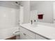 Bright bathroom features a shower and tub combo with white tile surround and a white vanity at 11021 Dundarrach Ln # 40, Charlotte, NC 28277