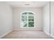 Bedroom with neutral carpet, a window that provides natural light and fresh air, and freshly painted walls at 11021 Dundarrach Ln # 40, Charlotte, NC 28277