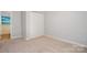 Bedroom with neutral carpet, a closet for storage, and freshly painted walls at 11021 Dundarrach Ln # 40, Charlotte, NC 28277