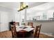 Well lit dining room with an open view to the modern kitchen at 11021 Dundarrach Ln # 40, Charlotte, NC 28277