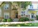 Charming townhome with stone accents, manicured bushes and neutral vinyl siding at 11021 Dundarrach Ln # 40, Charlotte, NC 28277