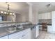 A well-lit kitchen with stainless steel appliances, a tiled backsplash, and updated cabinets at 11021 Dundarrach Ln # 40, Charlotte, NC 28277