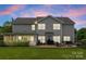 Spacious backyard with a patio, fire pit, and a screened-in porch, great for outdoor living at 112 Steeplechase Ave, Mooresville, NC 28117