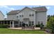 Gray siding home with patio, outdoor grill, and spacious windows allowing natural light at 112 Steeplechase Ave, Mooresville, NC 28117