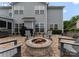 Backyard patio with stone fire pit and backyard at 112 Steeplechase Ave, Mooresville, NC 28117
