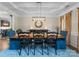 Formal dining room with a large table, elegant chairs, and a decorative chandelier at 112 Steeplechase Ave, Mooresville, NC 28117