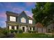 Charming two-story home featuring a manicured lawn and a welcoming front porch at 112 Steeplechase Ave, Mooresville, NC 28117