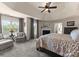 Spacious main bedroom with a seating area, fireplace, and natural light at 112 Steeplechase Ave, Mooresville, NC 28117