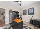 Home office featuring a built-in desk and shelving, neutral walls, a guitar and natural light at 112 Steeplechase Ave, Mooresville, NC 28117