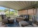 Inviting screened porch with a fire pit and comfortable seating for enjoying the outdoors at 112 Steeplechase Ave, Mooresville, NC 28117