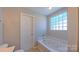 This bathroom features a relaxing soaking tub and natural light at 11514 Hattie Little St, Charlotte, NC 28269