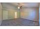 An expansive bedroom with plush carpet and neutral paint provides a flexible space at 11514 Hattie Little St, Charlotte, NC 28269
