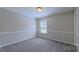 Bedroom featuring neutral walls, carpet, and a window bringing in natural light at 11514 Hattie Little St, Charlotte, NC 28269