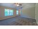 A lovely bedroom with neutral walls and plush carpeting providing a comfortable retreat at 11514 Hattie Little St, Charlotte, NC 28269