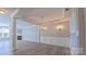 Spacious dining room with elegant lighting, crown molding, and wood floors at 11514 Hattie Little St, Charlotte, NC 28269