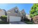 Charming two-story home features an attached garage and well-maintained landscaping at 11514 Hattie Little St, Charlotte, NC 28269