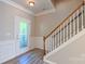 Inviting foyer with a staircase and decorative front door at 11514 Hattie Little St, Charlotte, NC 28269